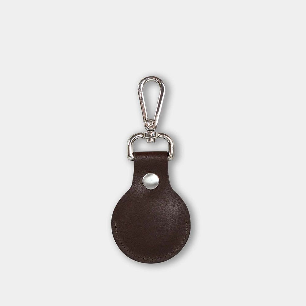 Back of a leather airtag pendant with snap hook