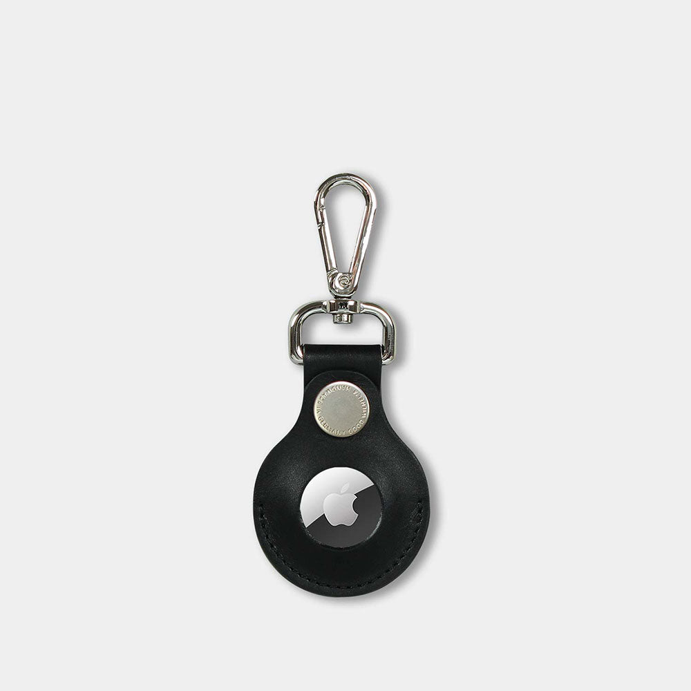 Front of an airtag pendant made from black vachetta leather