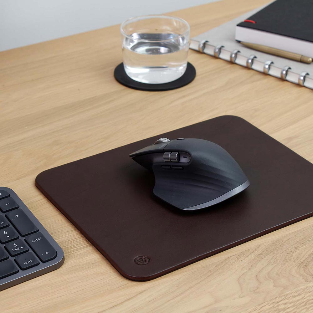 Computer mouse on mousepad leather OSKAR by Goodwilhelm in the color chocolate on a desk