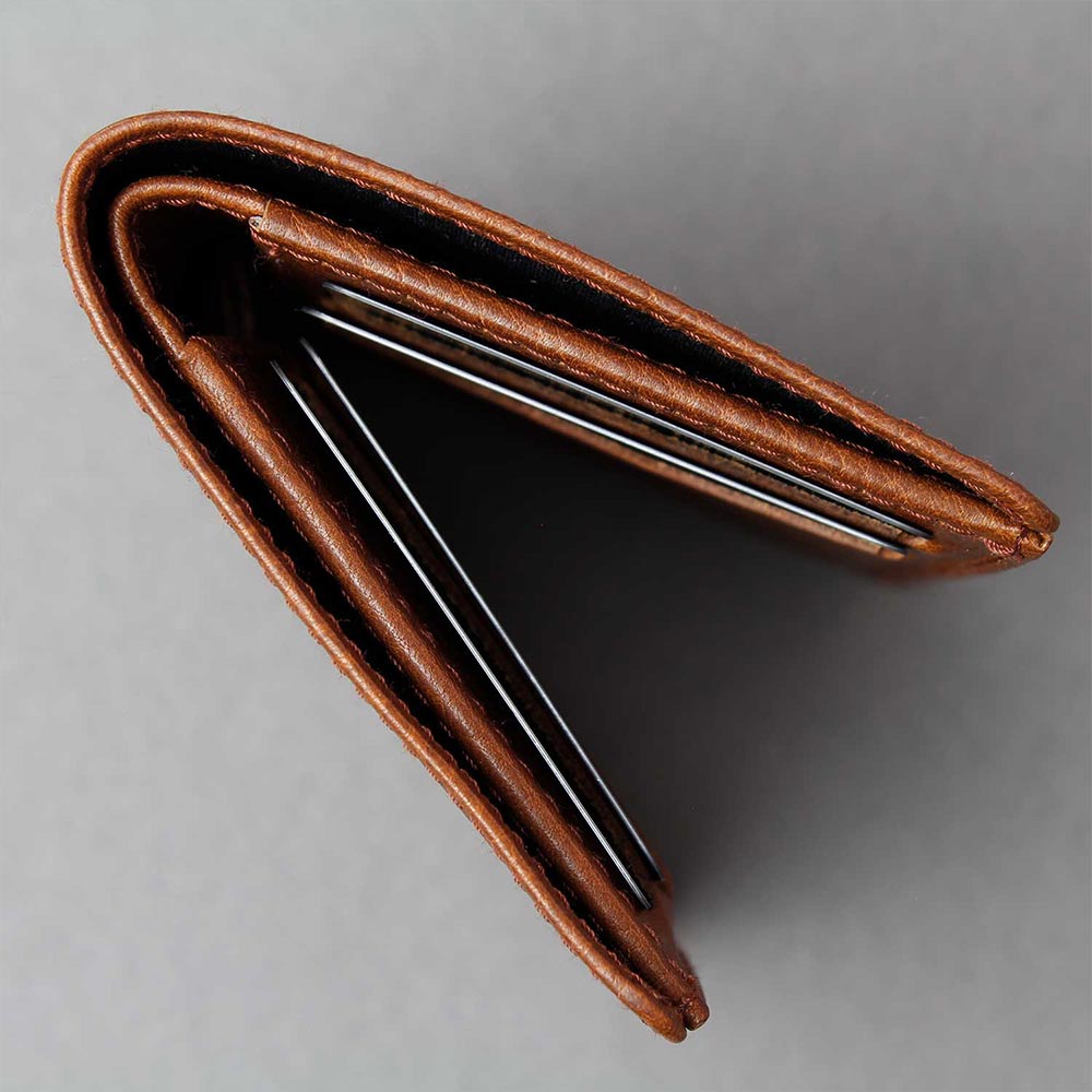 Wallet GUSTAV by Goodwilhelm in side view and in the color cognac