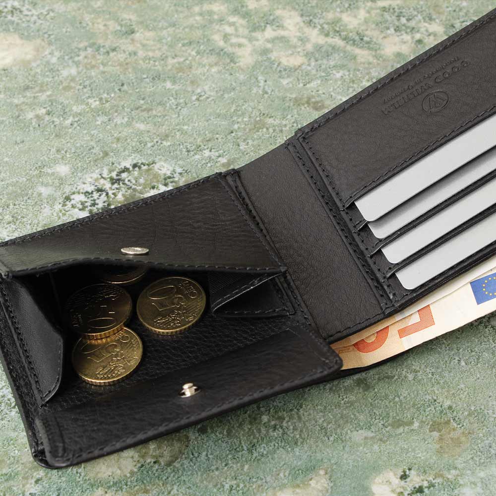 Side view of a black leather wallet with open coin compartment, bill compartment and card compartment, high-quality workmanship, on marble - Good Wilhelm